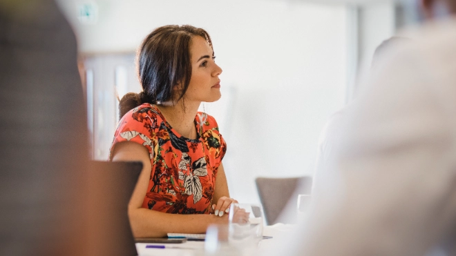 Young office worker wearing an orange blouse