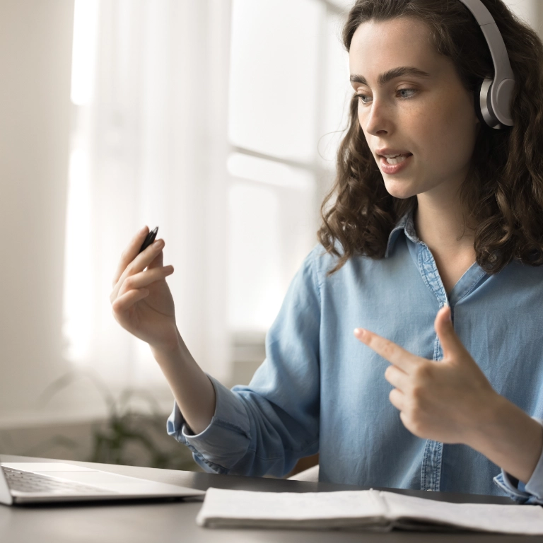 woman at laptop with a headset