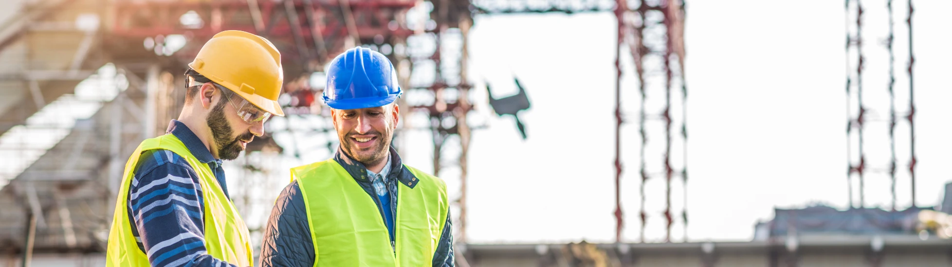 two construction workers conducting a survey