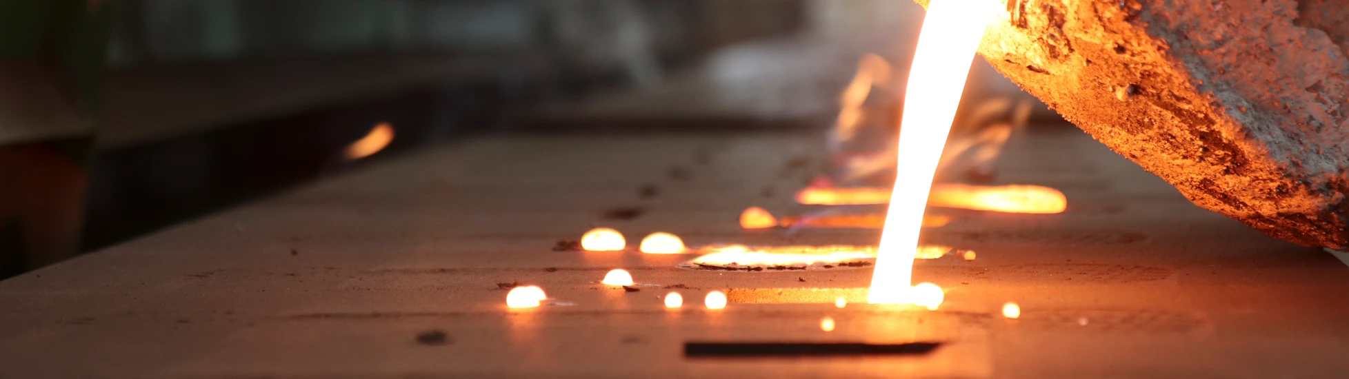 Iron molten metal pouring in sand mold_