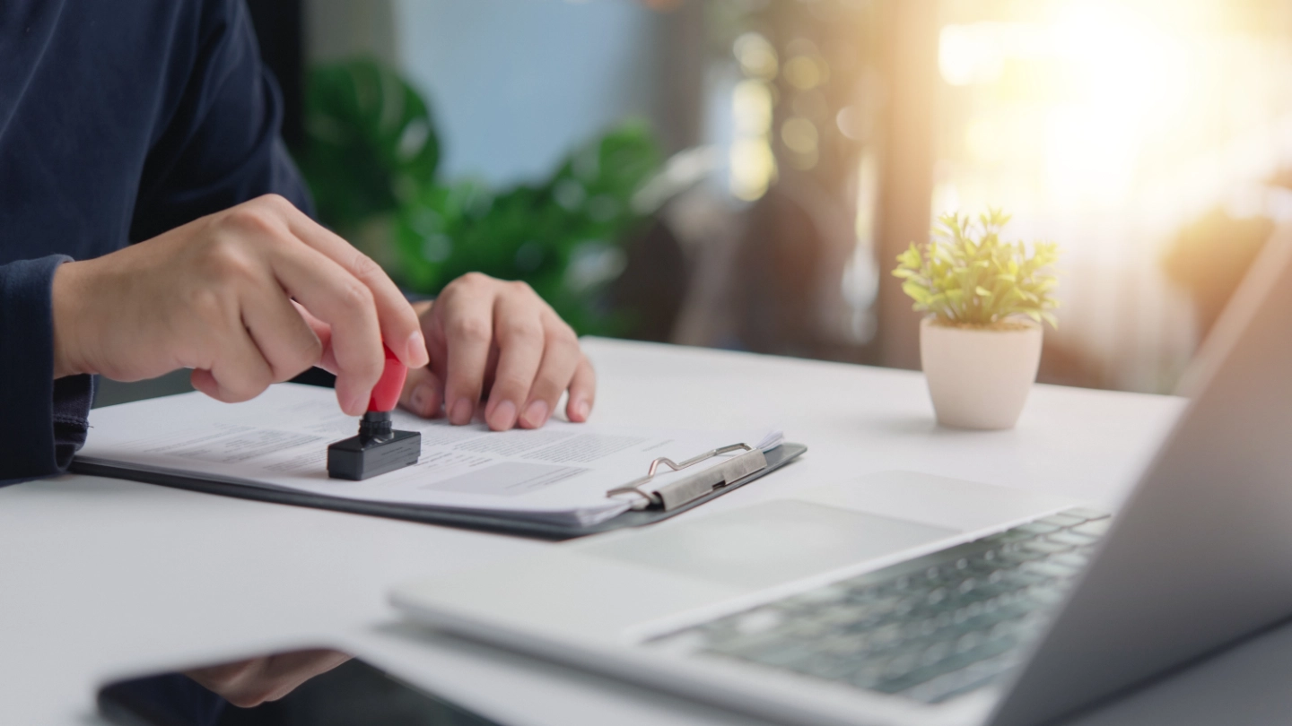 individual business person stamps document approval