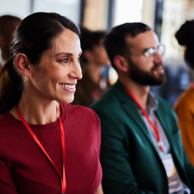 Smiling woman attending a business seminar
