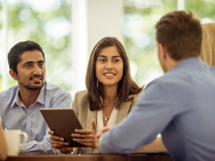 men and woman in a meeting