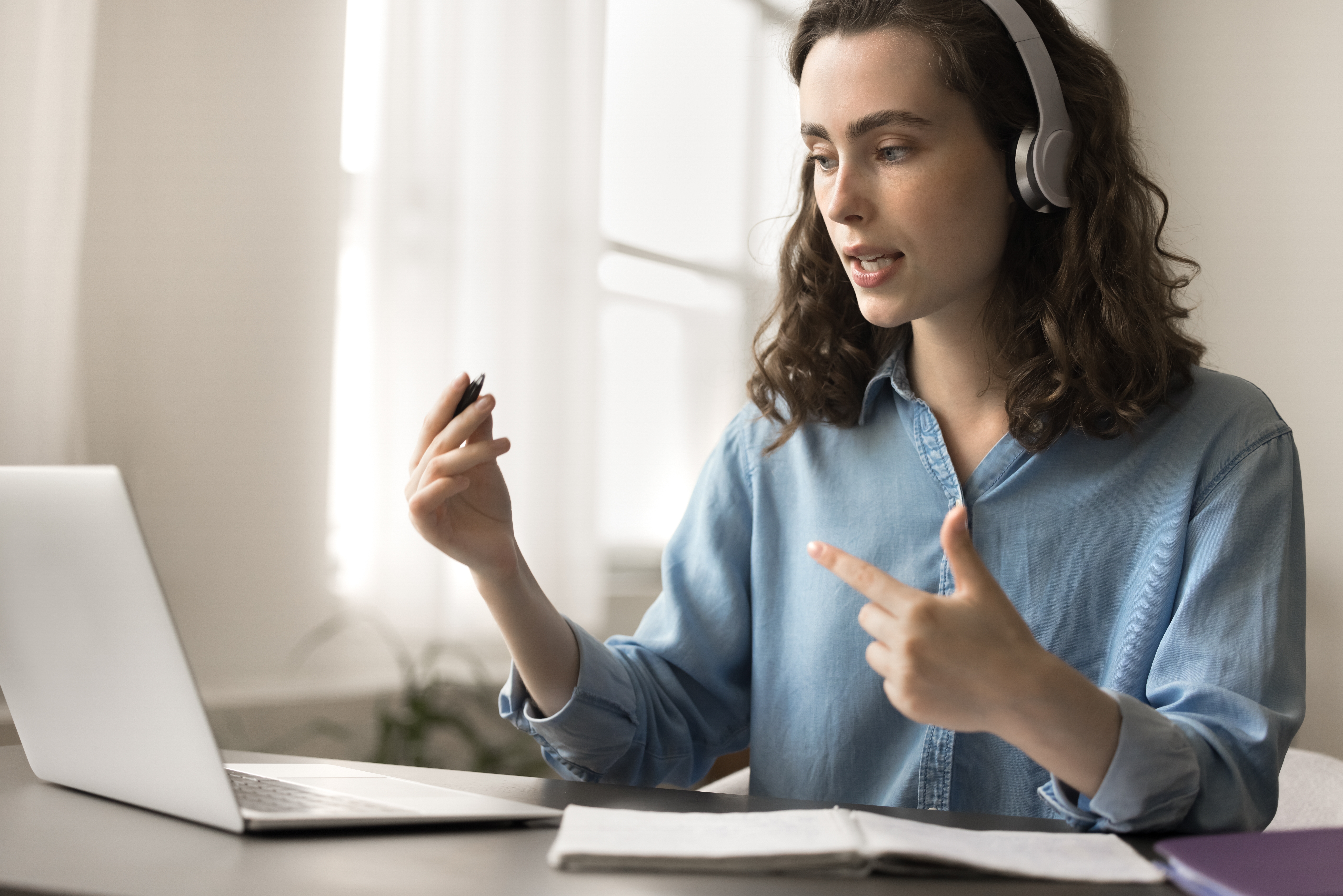 woman at laptop with a headset